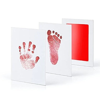Unboxing a newborn baby handprint footprint kit, revealing the safe ink pad and quality cards.