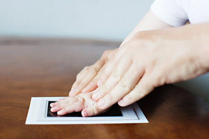 Toddler handprint captured with the non-toxic ink pad kit, a cherished keepsake for families