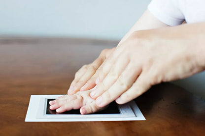 Footprint kit for infants, capturing tiny toes with safe, non-toxic ink, a precious souvenir