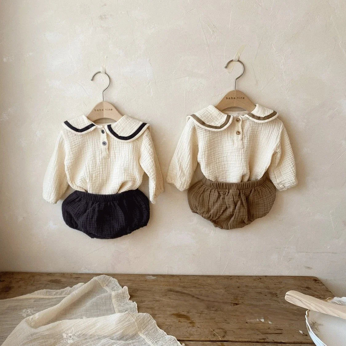 Newborn baby in full Autumn Collar Top & Bread Bottoms Set, cozy cotton, front view.