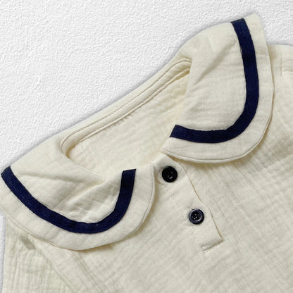 Infant fashion: newborn baby in cozy autumn collar top & bread bottoms outfit.
