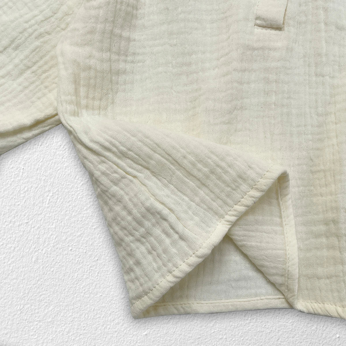 Newborn baby wearing autumn collar top with subtle texture detail, cozy for winter.