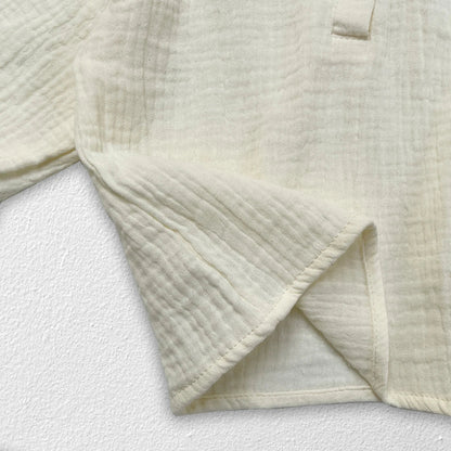 Newborn baby wearing autumn collar top with subtle texture detail, cozy for winter.
