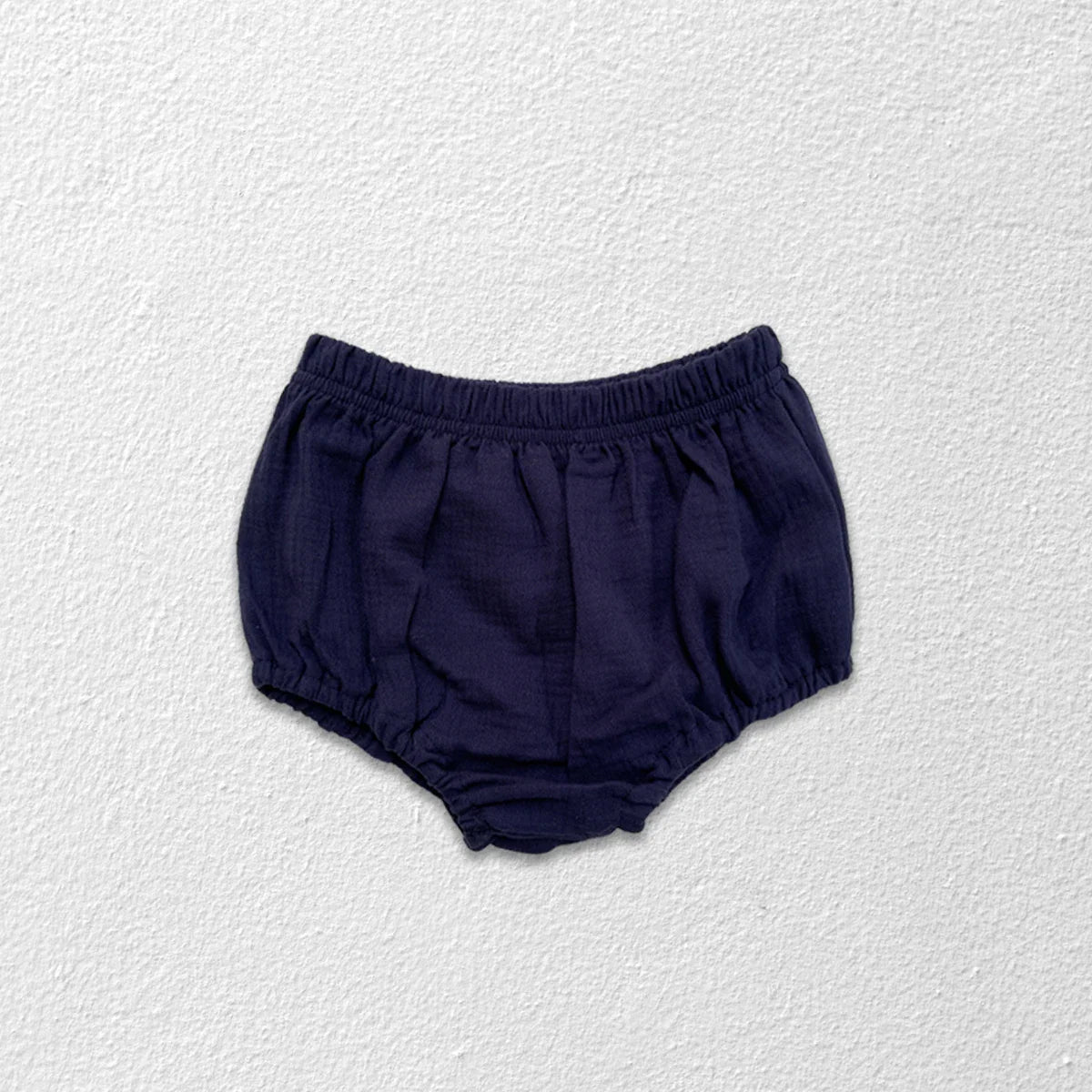 Bread bottoms for baby, showing ribbed cuffs and loose fit for infant comfort.