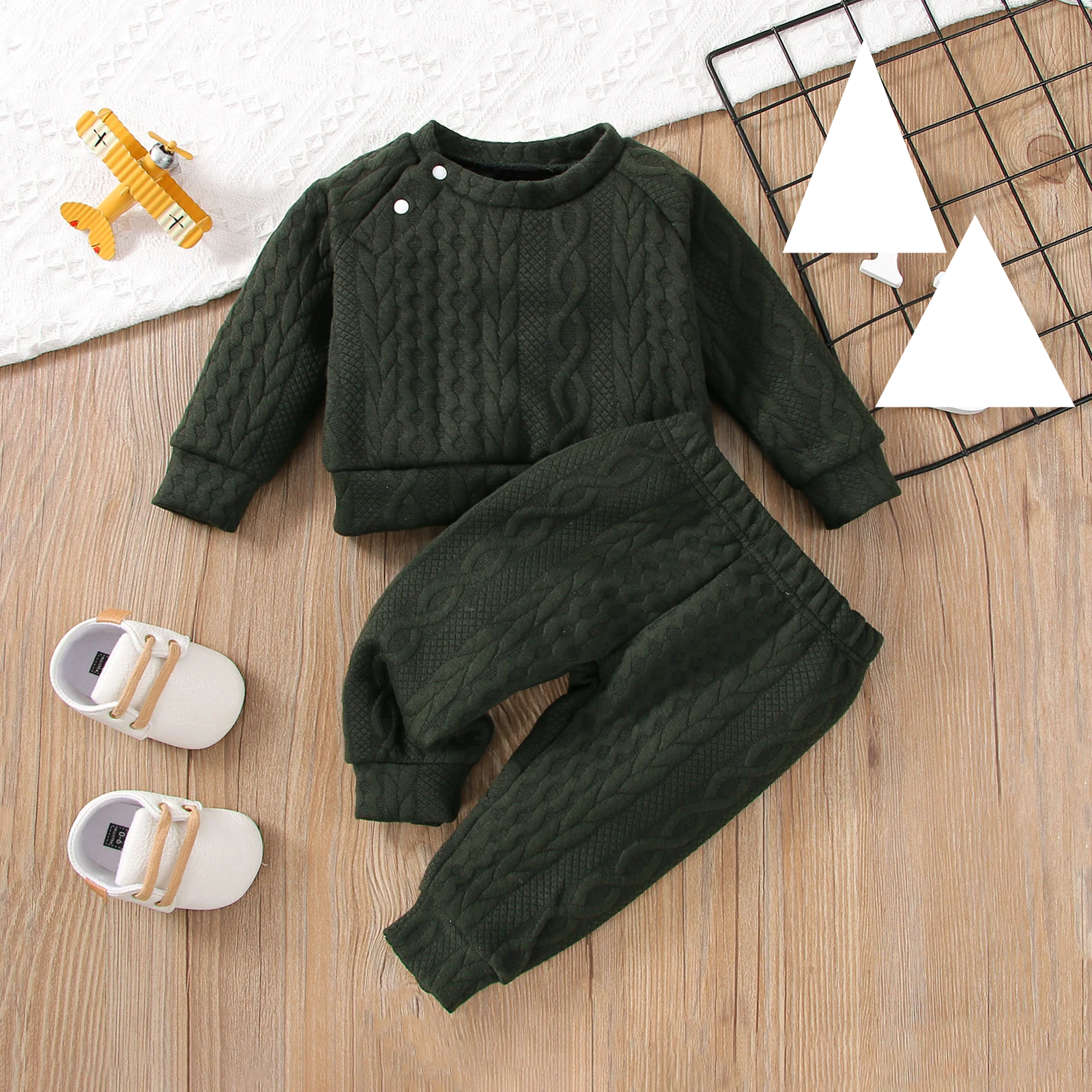 Two-piece infant outfit featuring a long-sleeved shirt and coordinating baby pants in cotton blend
