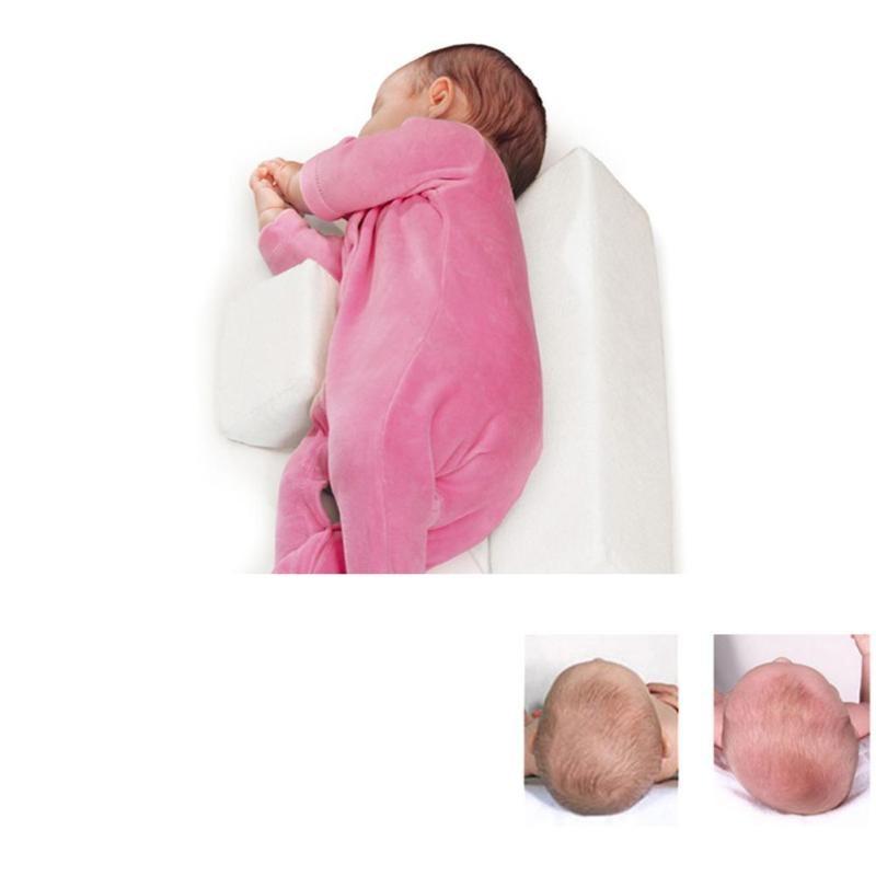 Newborn baby sleep positioner pillow for comfortable, safe sleep & flat head prevention.