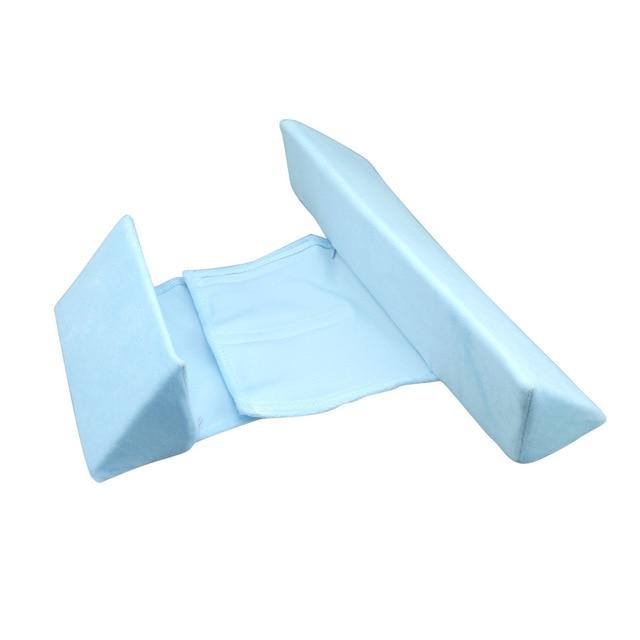 Infant sleep positioner pillow providing gentle support & safety to prevent flat head syndrome.