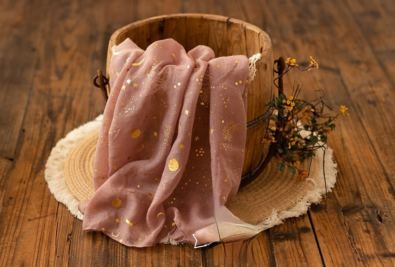 Celestial star moon print baby swaddle wrap, made from soft cotton, perfect for newborn comfort.