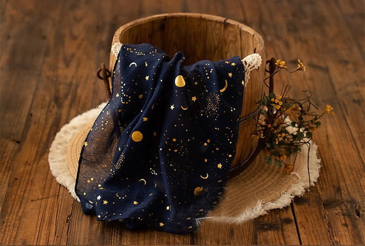 Adorable star & moon print baby swaddle wrap, a soft cotton photo prop for newborns.