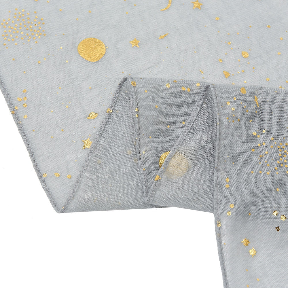 Gentle comfort star & moon print baby swaddle wrap, soft cotton for secure newborn sleep.