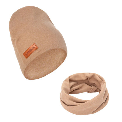 Close view of the soft textured fabric of a baby turban hat and scarf set.