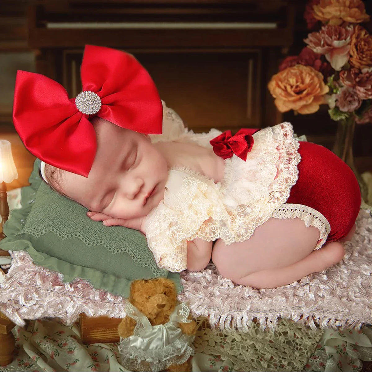 Newborn baby wearing a soft red rhinestone headband, perfect for photography props and baby headwear