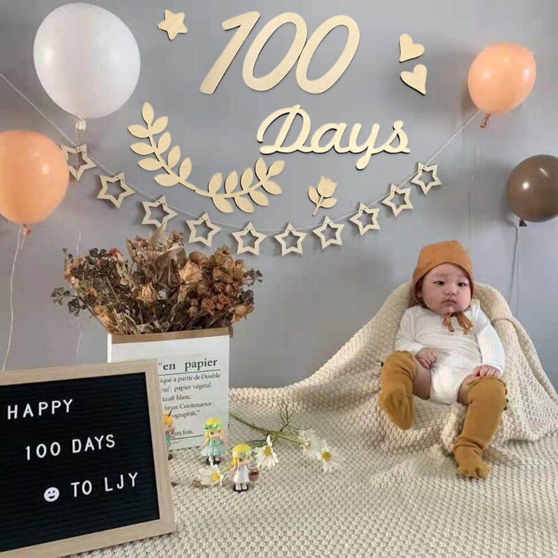 Set of wooden baby milestone cards, newborn photography props and growth trackers for babies.