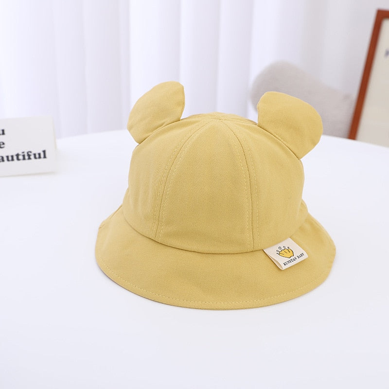 Newborn bear-themed bucket hat, providing essential sun protection and style.