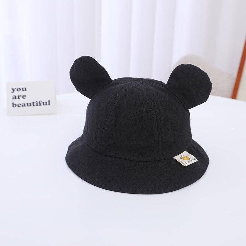 Lightweight baby sun hat with bear design, great for outdoor adventures.