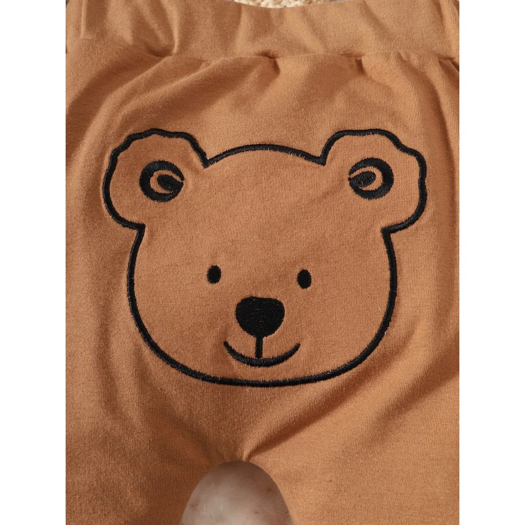 Newborn boys' fashion outfit set, short sleeve top and coordinated shorts with a popular bear print motif.