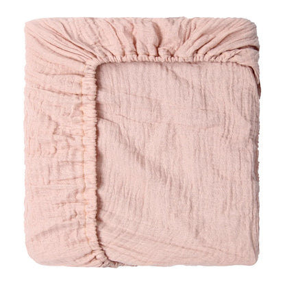 Texture shot of soft breathable cotton fabric for a newborn cartoon fitted crib sheet, perfect for infants