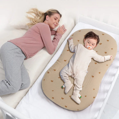 Baby crib with a fitted cartoon sheet, soft breathable cotton for newborn essentials and comfortable sleep