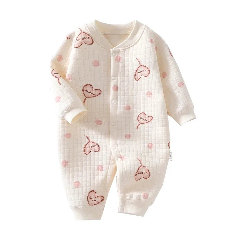 Sleeping baby in a comfortable unisex cotton bear romper, ideal for newborn naps