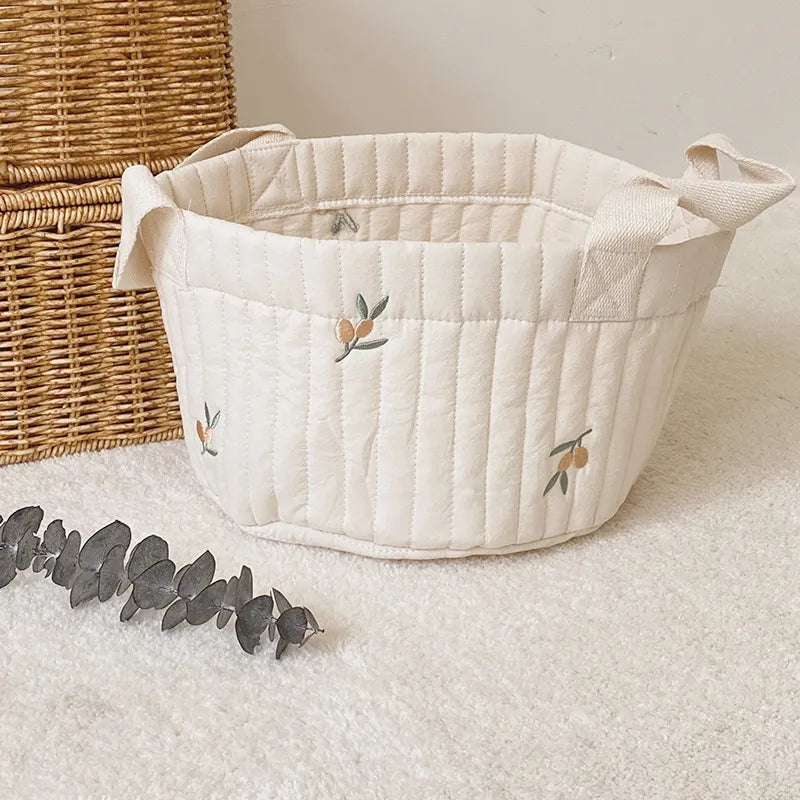 Modern newborn diaper caddy, easy-to-carry storage for baby's changing station.