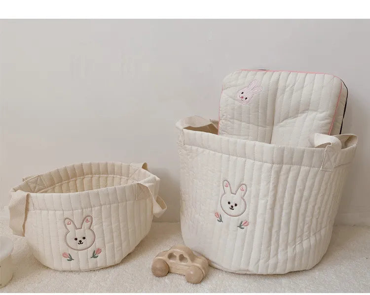 Cotton diaper caddy for all baby essentials; perfect modern nursery accessory.