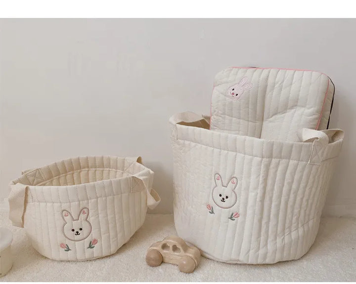 Cotton diaper caddy for all baby essentials; perfect modern nursery accessory.