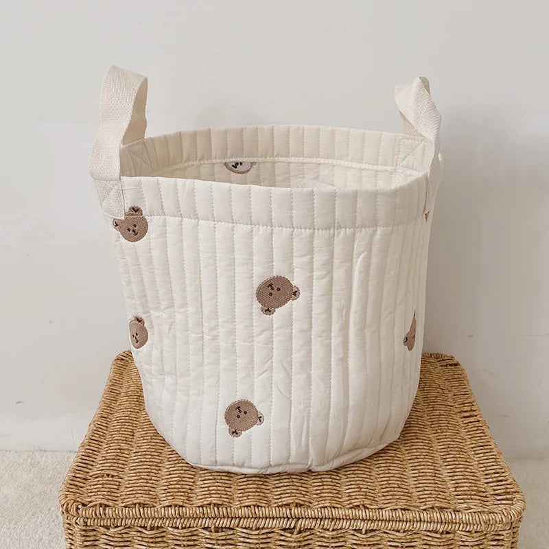 Nursery storage caddy with bear print, organizes diapers, wipes & baby toys.