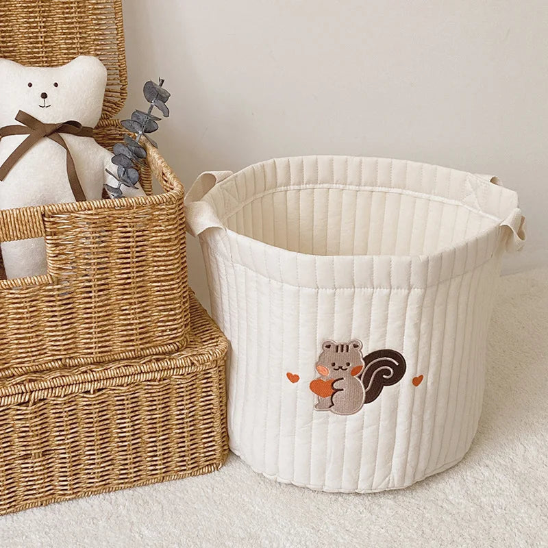 Portable diaper caddy for changing station; keeps baby essentials neatly organized.