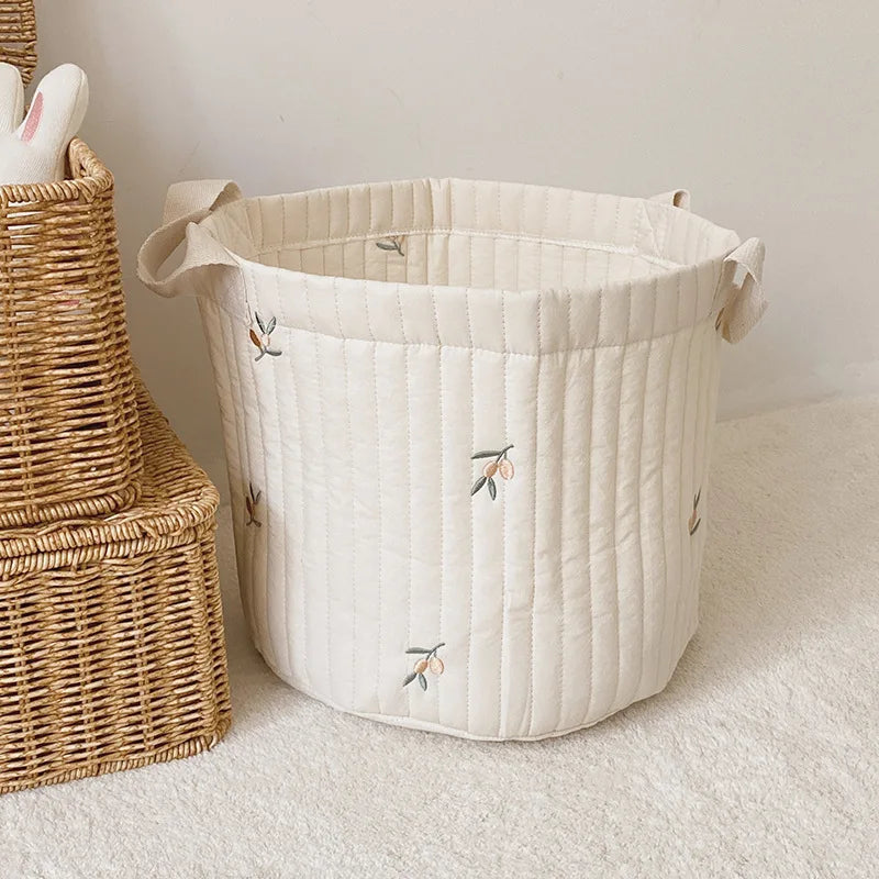 Diaper caddy & toy bag: Versatile nursery storage for newborn essentials.
