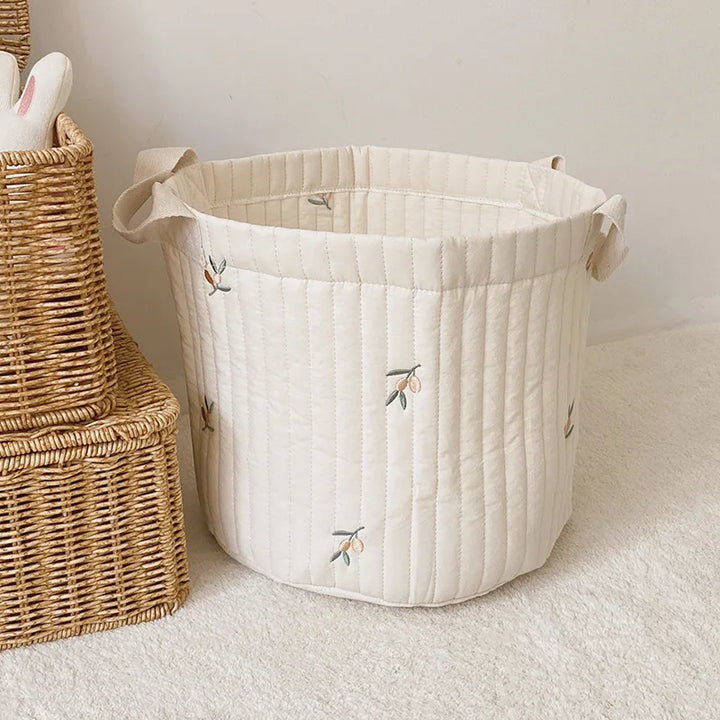 Diaper caddy & toy bag: Versatile nursery storage for newborn essentials.