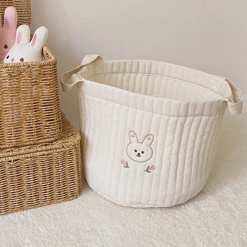 Baby shower gift: Practical cotton diaper caddy in an olive print.