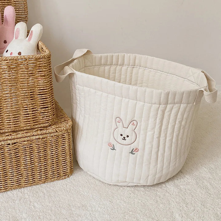 Baby shower gift: Practical cotton diaper caddy in an olive print.