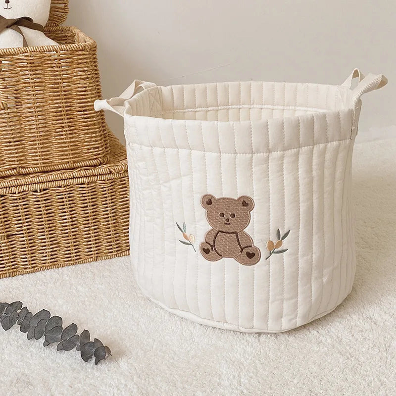 Nursery organizer caddy with multiple compartments for baby room essentials.