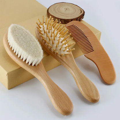 Newborn baby brush set showing both the wool brush and a fine-toothed wooden comb