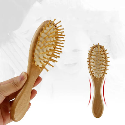 Stack of two wooden baby brushes, one with wool bristles, one for detangling