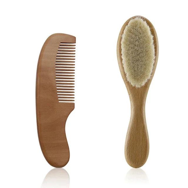 Gentle wooden comb from the newborn baby hair care set, ideal for fine infant hair