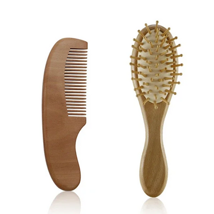 Arrangement of the wooden baby brush, comb, and other baby care items for scale