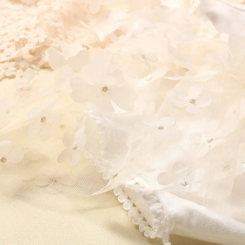 Close-up of the elastic headband with floral bow from the newborn photo set