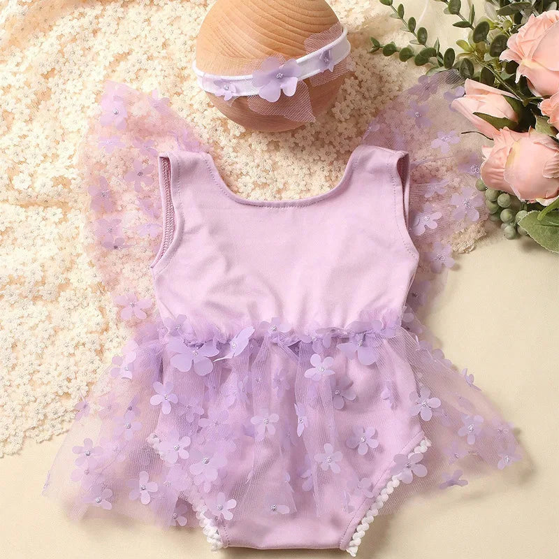 Adorably soft floral printed newborn romper with complementary pink headband
