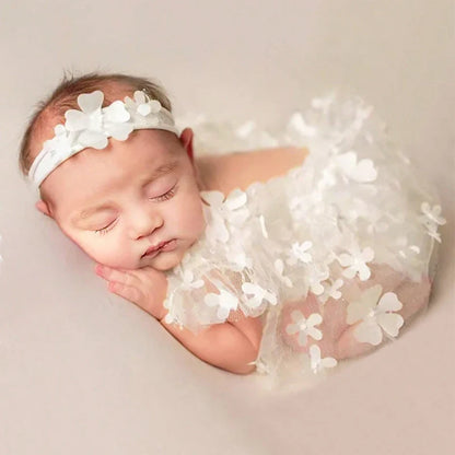 Close-up of pink and white floral pattern on newborn baby romper fabric