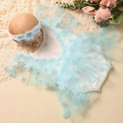 Infant girl's cute floral romper with leg ruffles and a matching floral headband