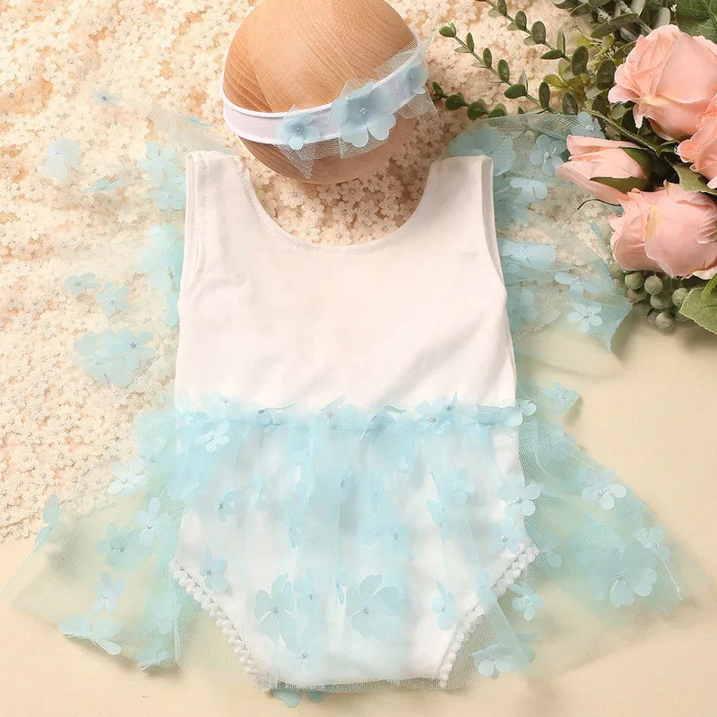 Pink floral baby romper and elastic headband set for newborn portrait sessions