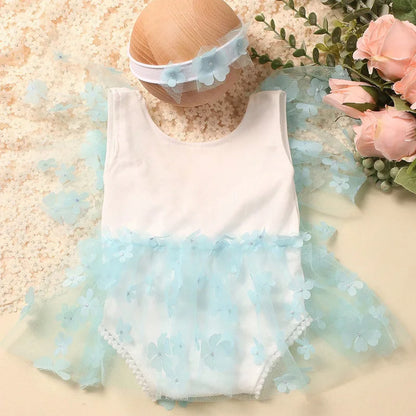 Pink floral baby romper and elastic headband set for newborn portrait sessions