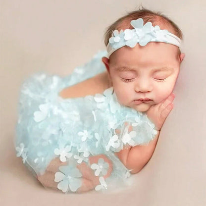 Soft pink floral romper with ruffled sleeves for newborn girl photo shoot