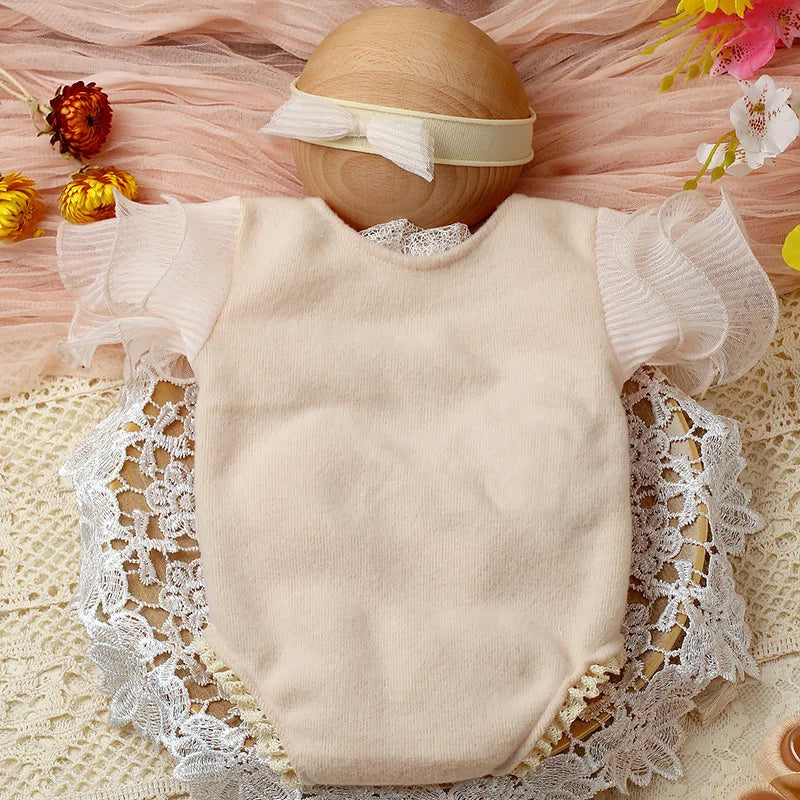 Beige lace romper with a sweet bow headband, essential baby couture for photo shoots