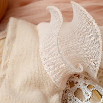 Newborn girl's lavender lace romper with a focus on the bow headband, a stylish baby accessory