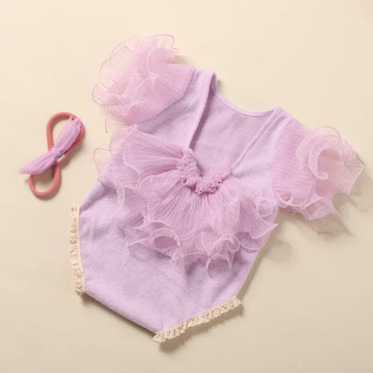 Beige lace romper and bow headband set, showcasing high-quality baby couture for newborns