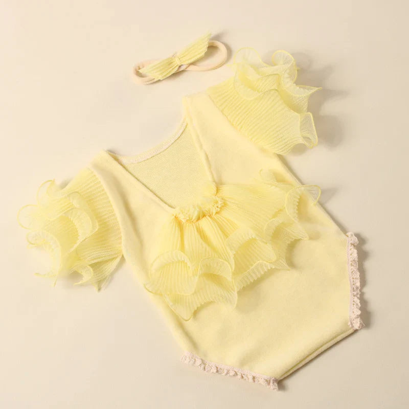 Assorted colors of newborn girl lace romper & bow headband sets: pink, lavender, yellow, beige