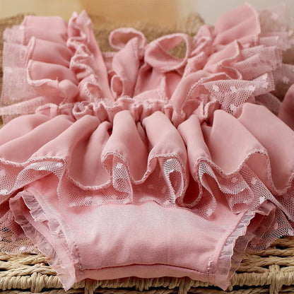 Newborn girl's light pink photography romper set featuring a comfortable romper and elegant headband.