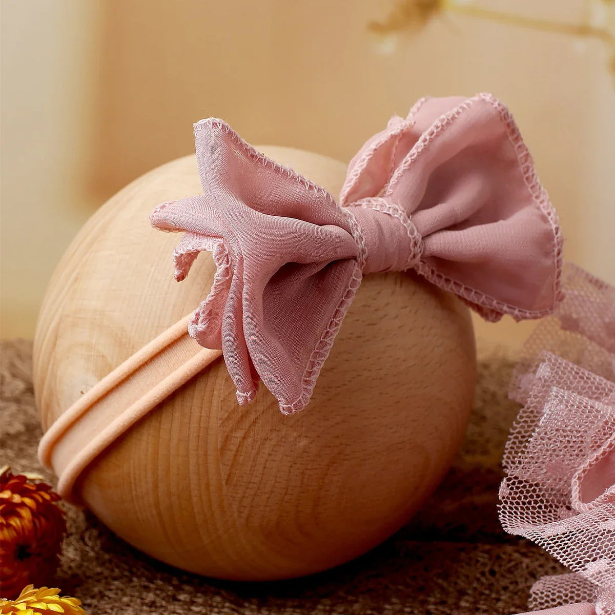 Gift-ready light pink baby romper and headband, an essential newborn photography prop for baby girls.